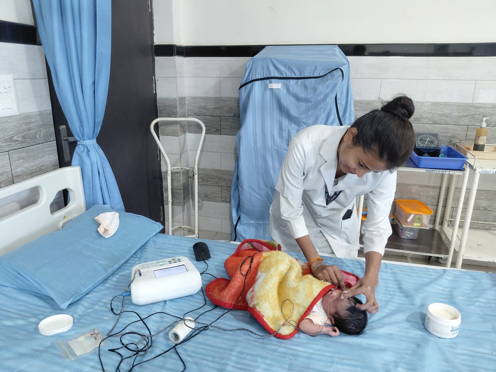 A doctor treating a small baby.