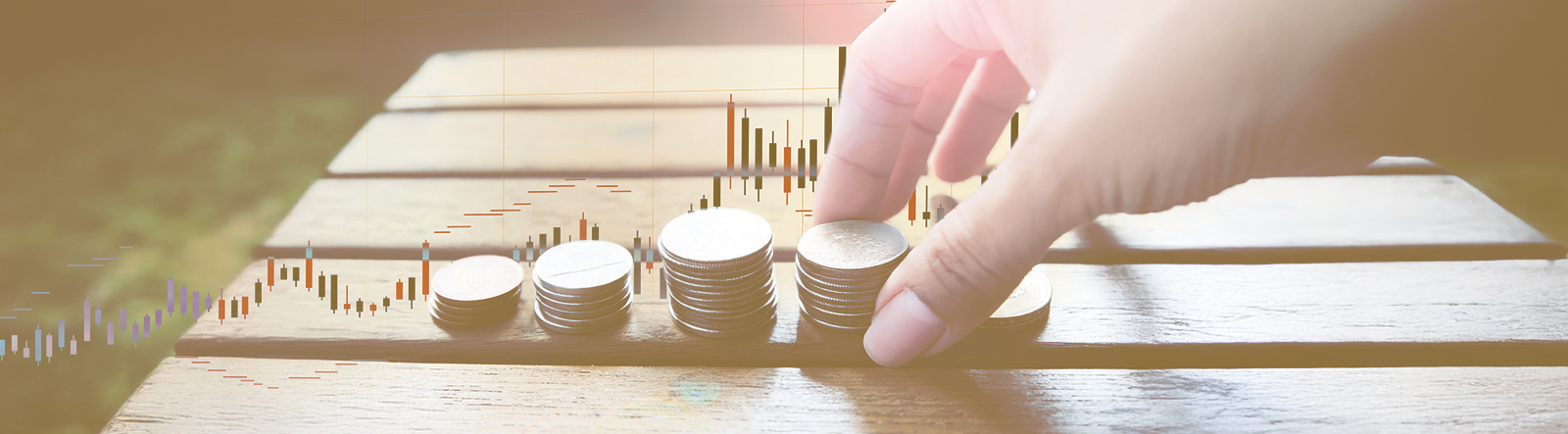 Article cover image depicting a person arranging coins in stacks.