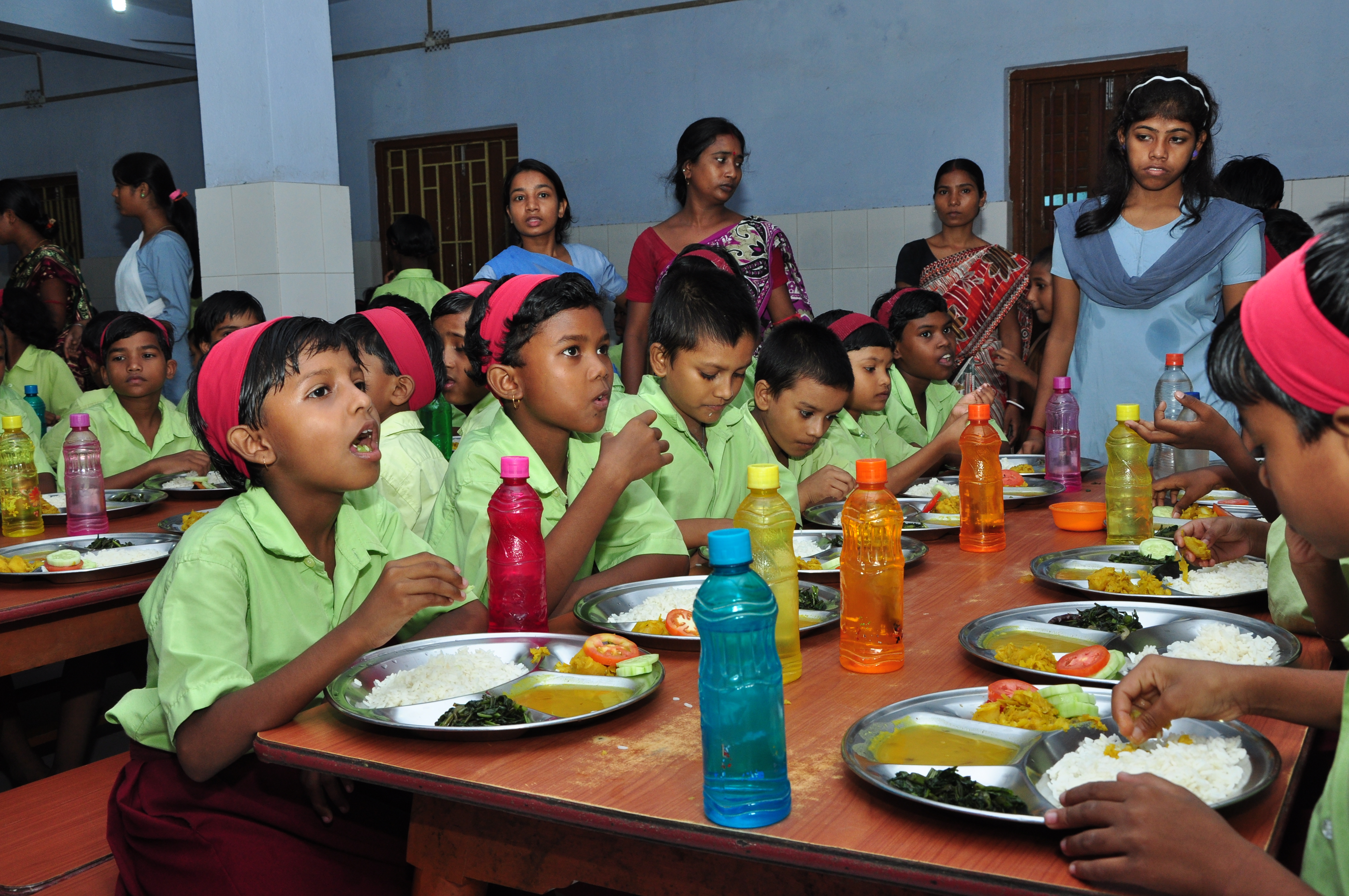 A group of children eating.