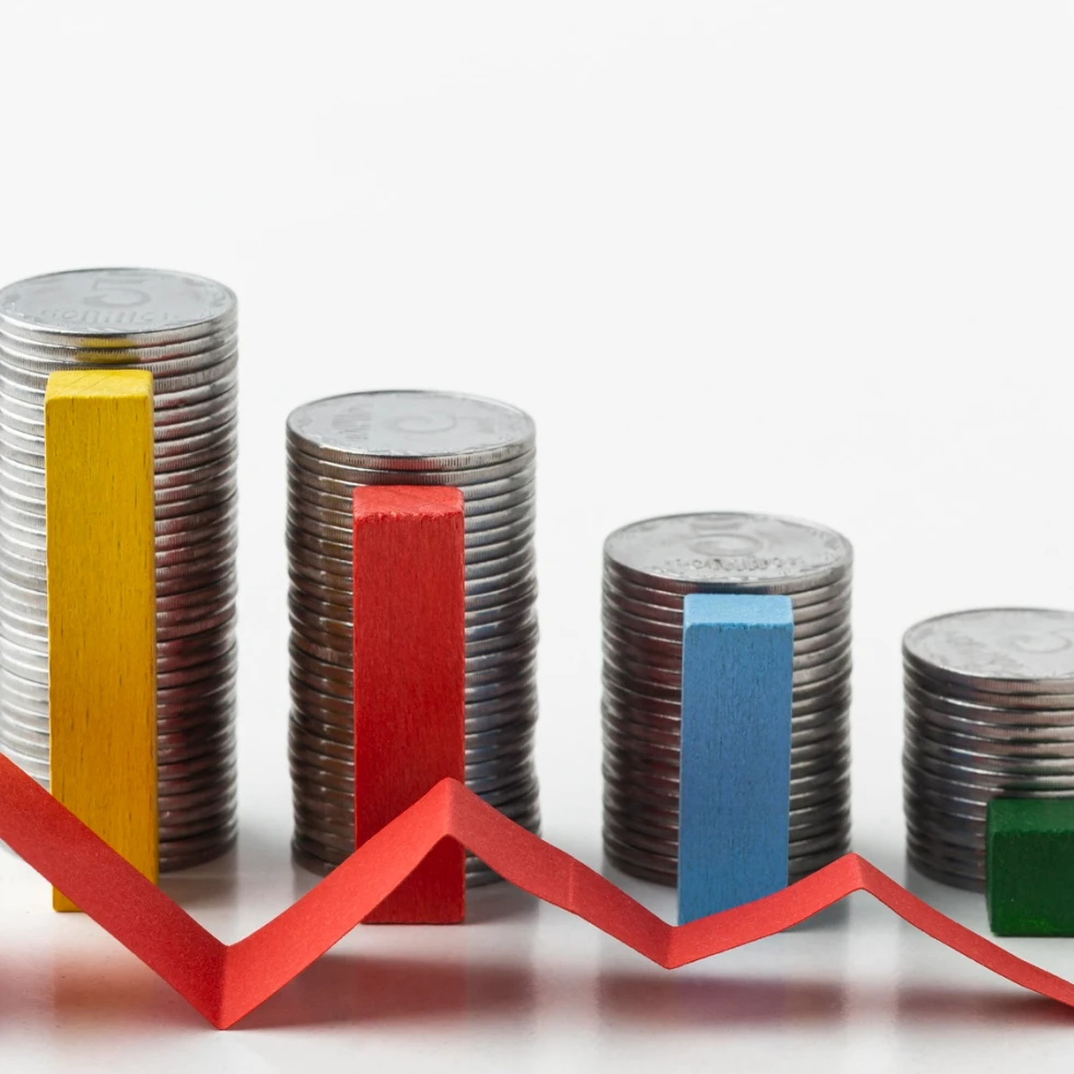Image of coins stacked in a descending order.