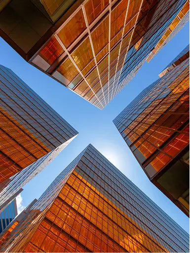 Listing image depicting four buildings from a bottom view.