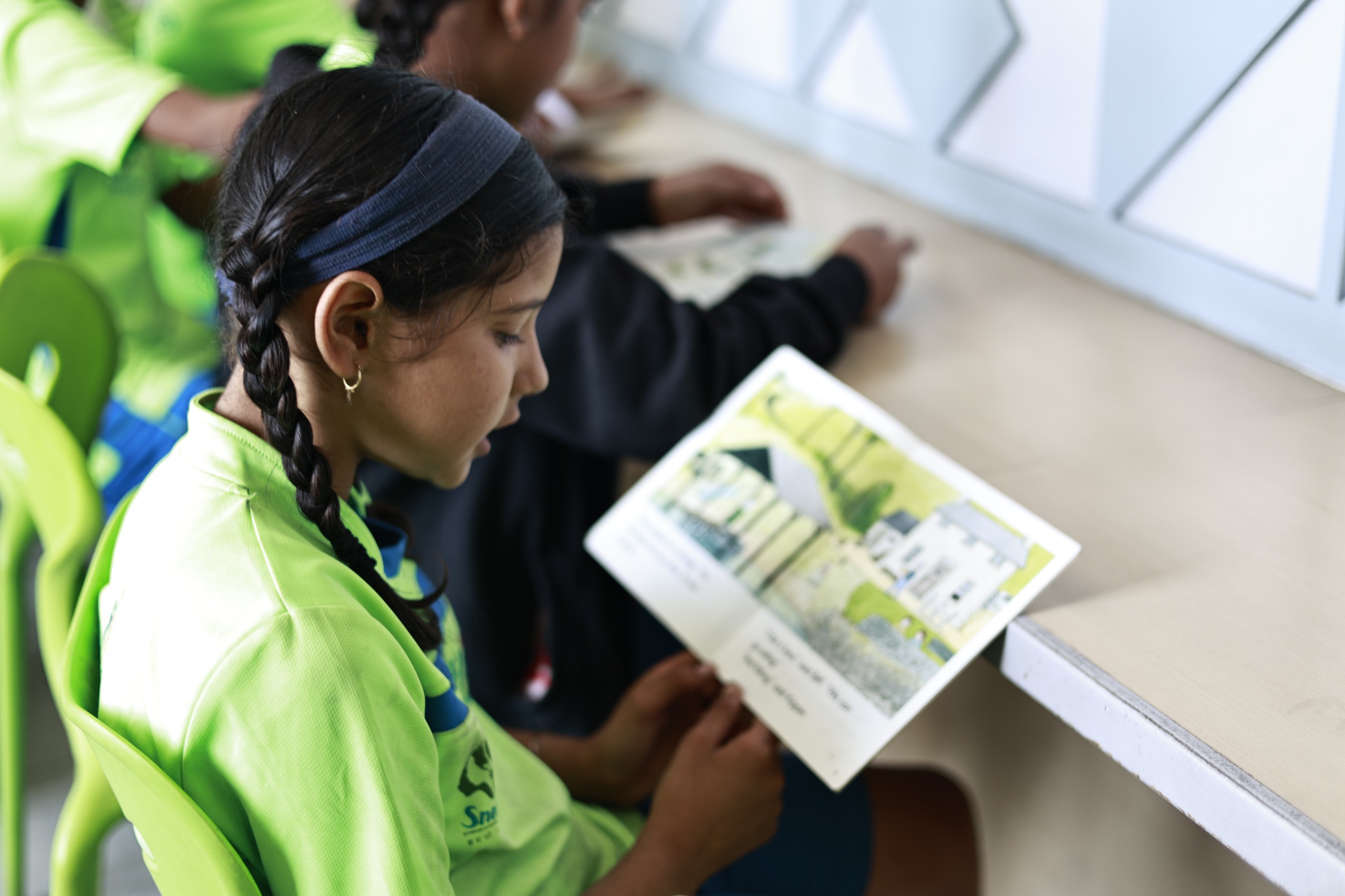 A girl reading a storybook