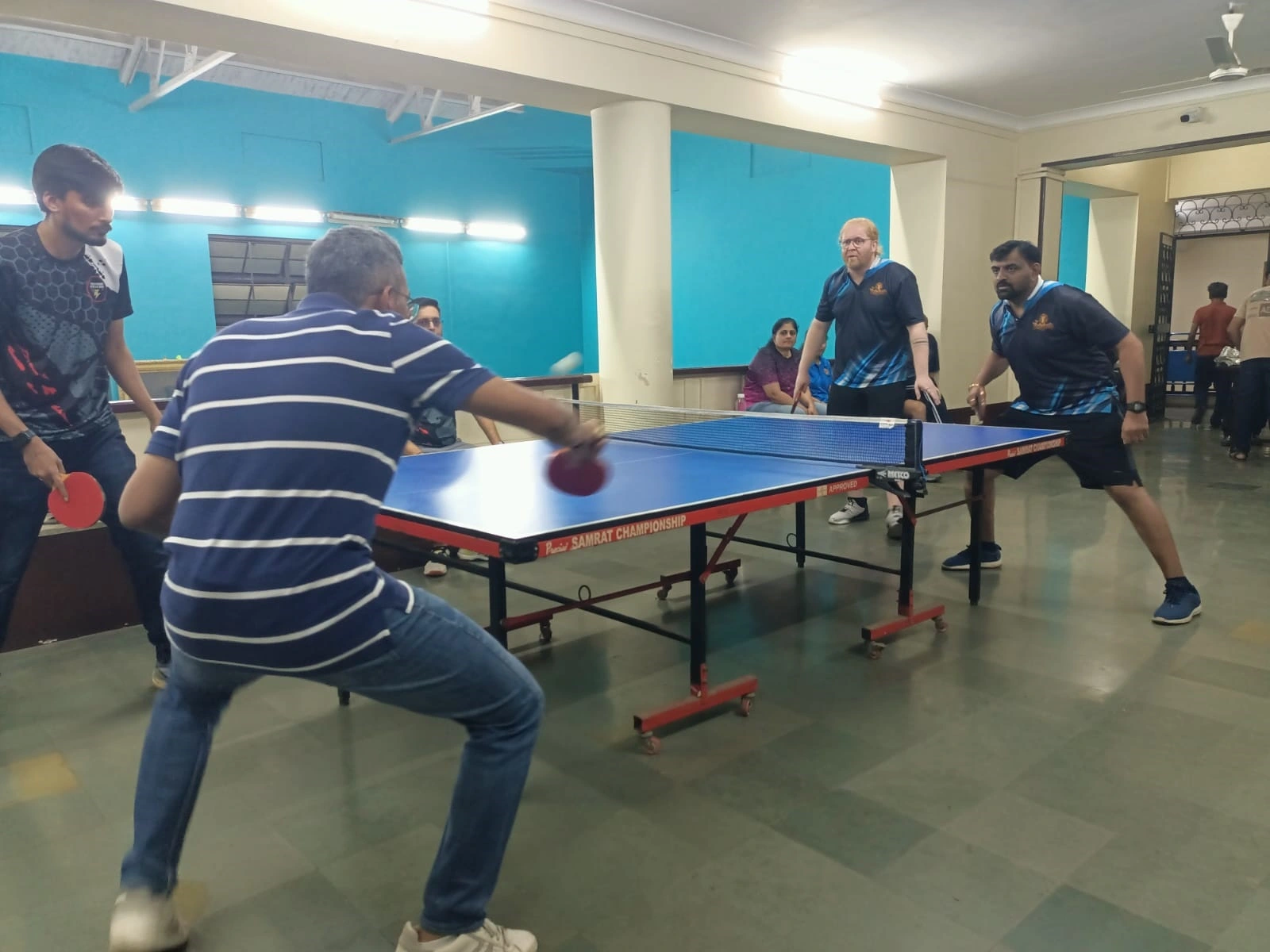 Alchemy team playing table tennis.