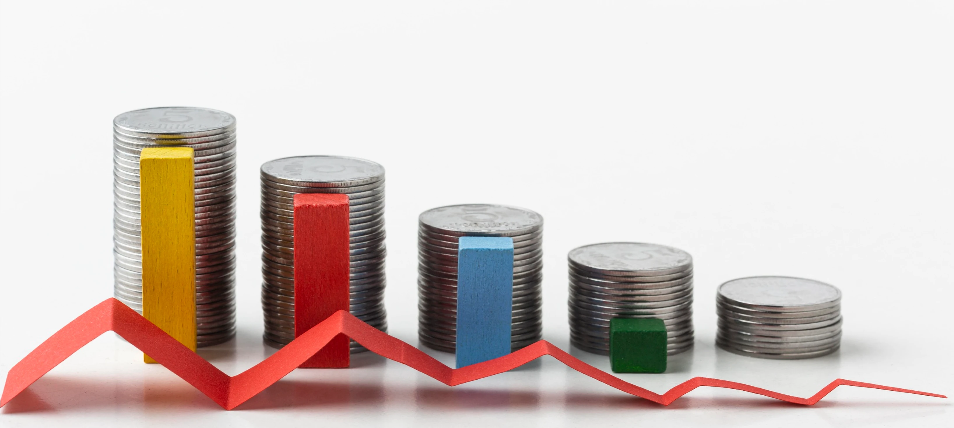 Image of coins stacked in a descending order.