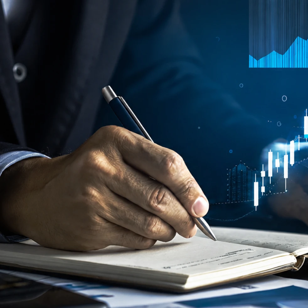 Featured image depicting a man writing in a notebook
