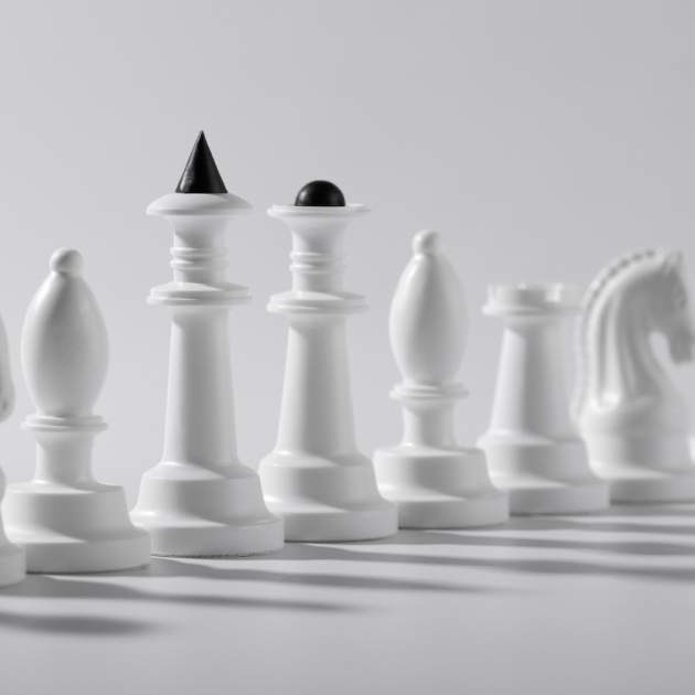Strategy Snapshot image depicting chess pieces in a line.